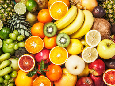 Aerial photo of lots of different fruits overlapping with each other filling the entire photo.