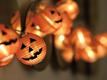 Close up photo of Jack-O-Lantern string lights.