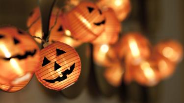 Close up photo of Jack-O-Lantern string lights.