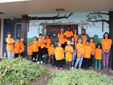 Photo of John Maclure students and ISW wearing orange shirts for orange shirt day in 2023.
