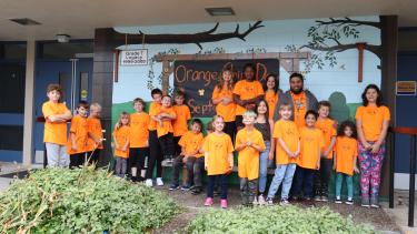 Photo of John Maclure students and ISW wearing orange shirts for orange shirt day in 2023.