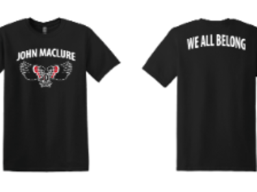 Image of a black t-shirt. Front says John Maclure with the thunderbird logo. Back says We All Belong in white.