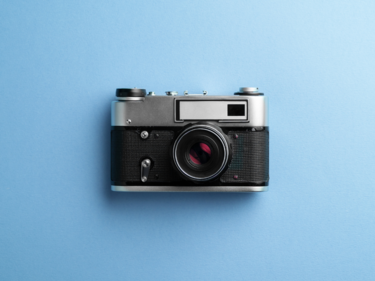 image of a film camera on a blue background
