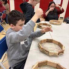 students work on their drums
