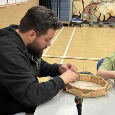 Mr. Julian, our former ISW, works on his drum